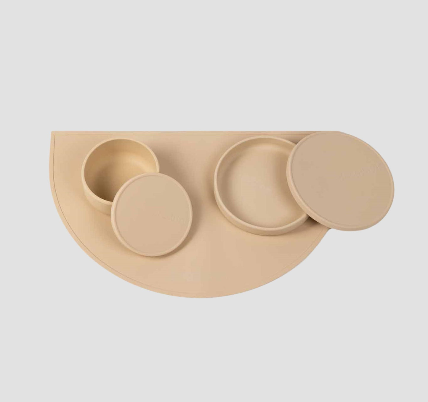 Food grade non-slip silicone dog feeding station which includes a dog bowls with lids & a dog food mat in beige.
