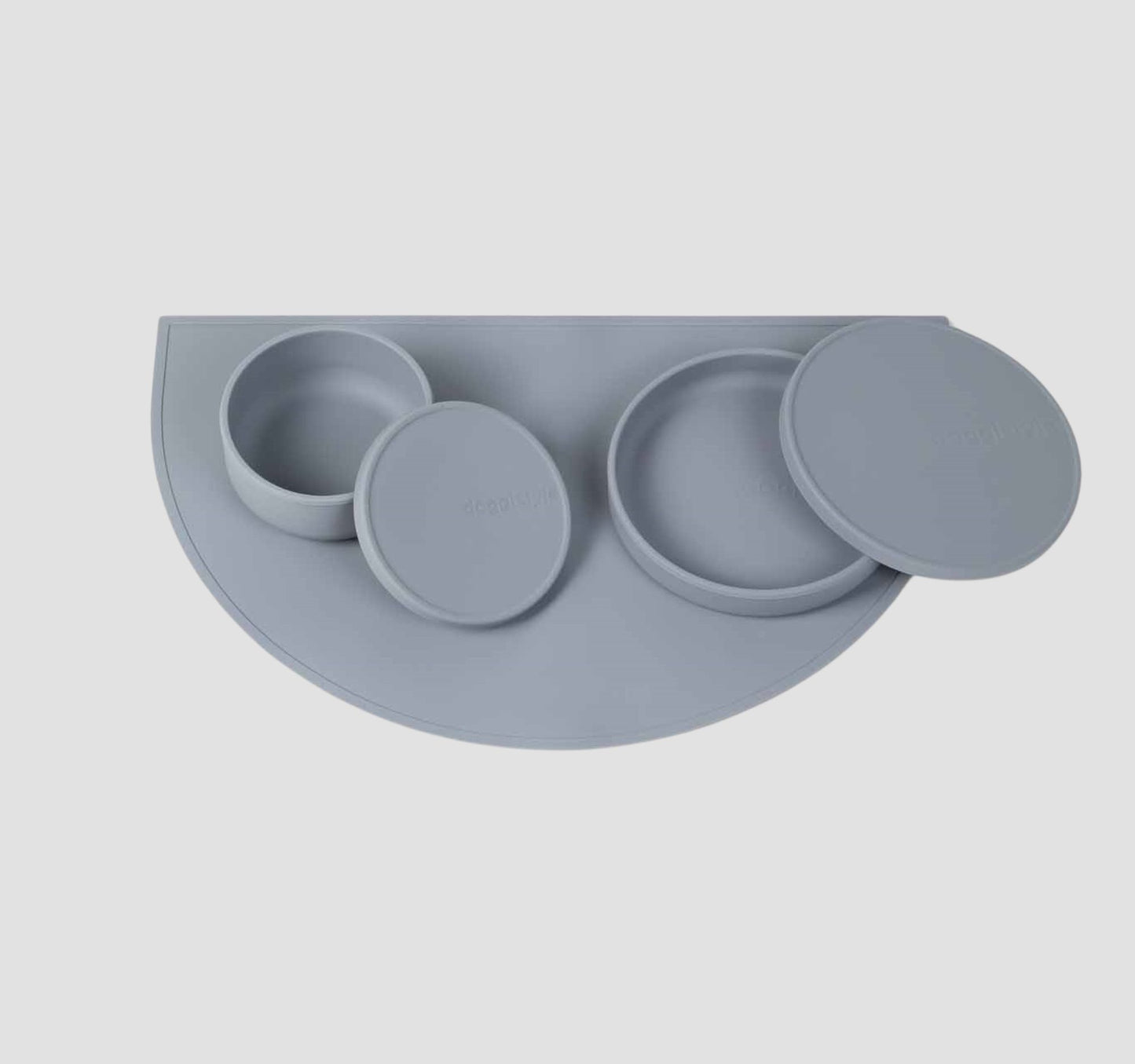 Food grade non-slip silicone dog feeding station which includes a dog bowls with lids & a dog food mat in blue.