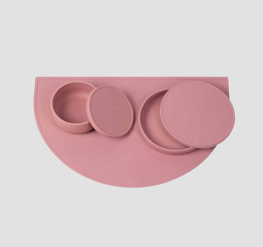 Food grade non-slip silicone dog feeding station which includes a dog bowls with lids & a dog food mat in pink.