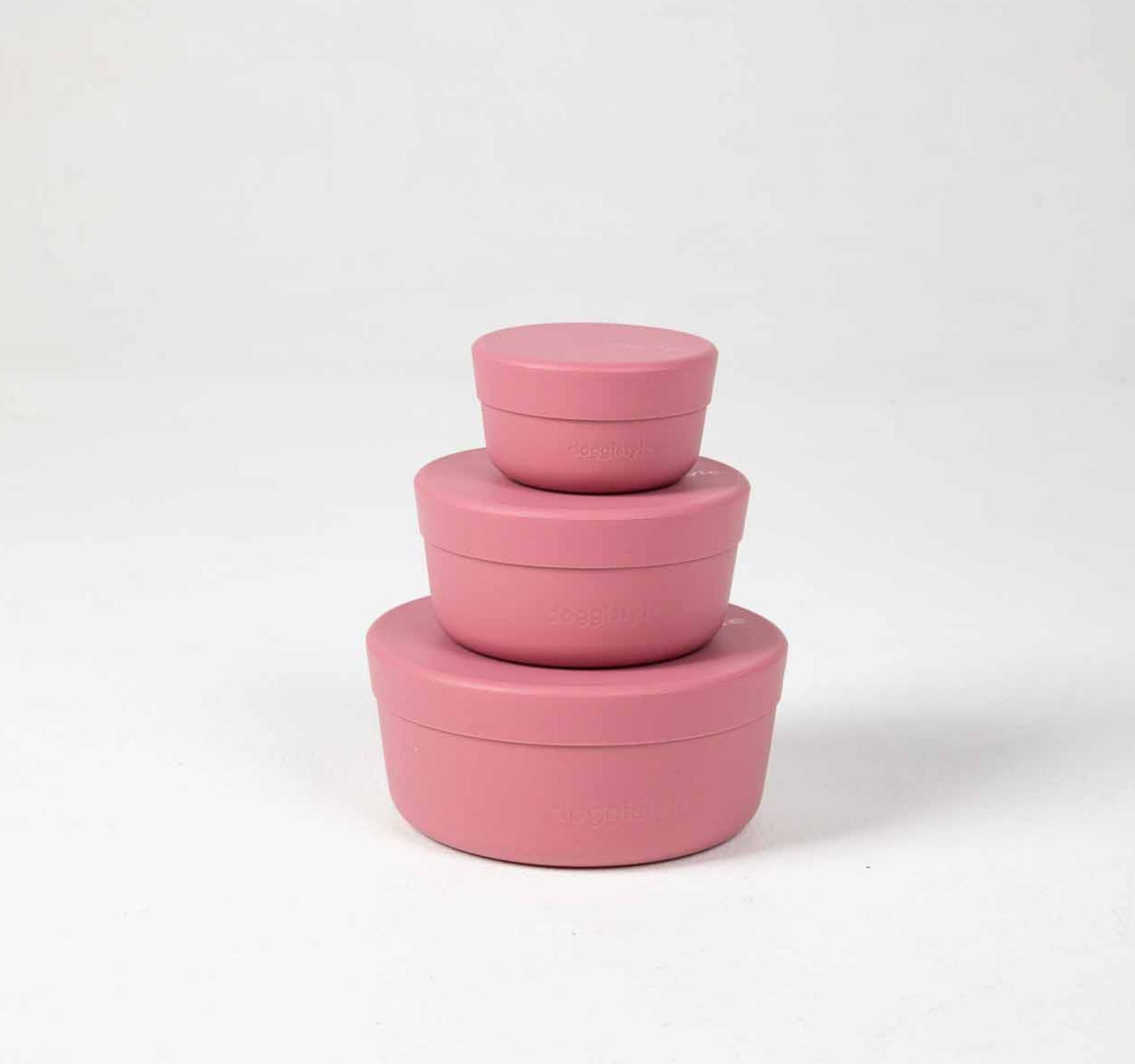  100% food grade silicone dog food storage nesting containers in three sizes 150ml, 350ml and 750ml in pink.
