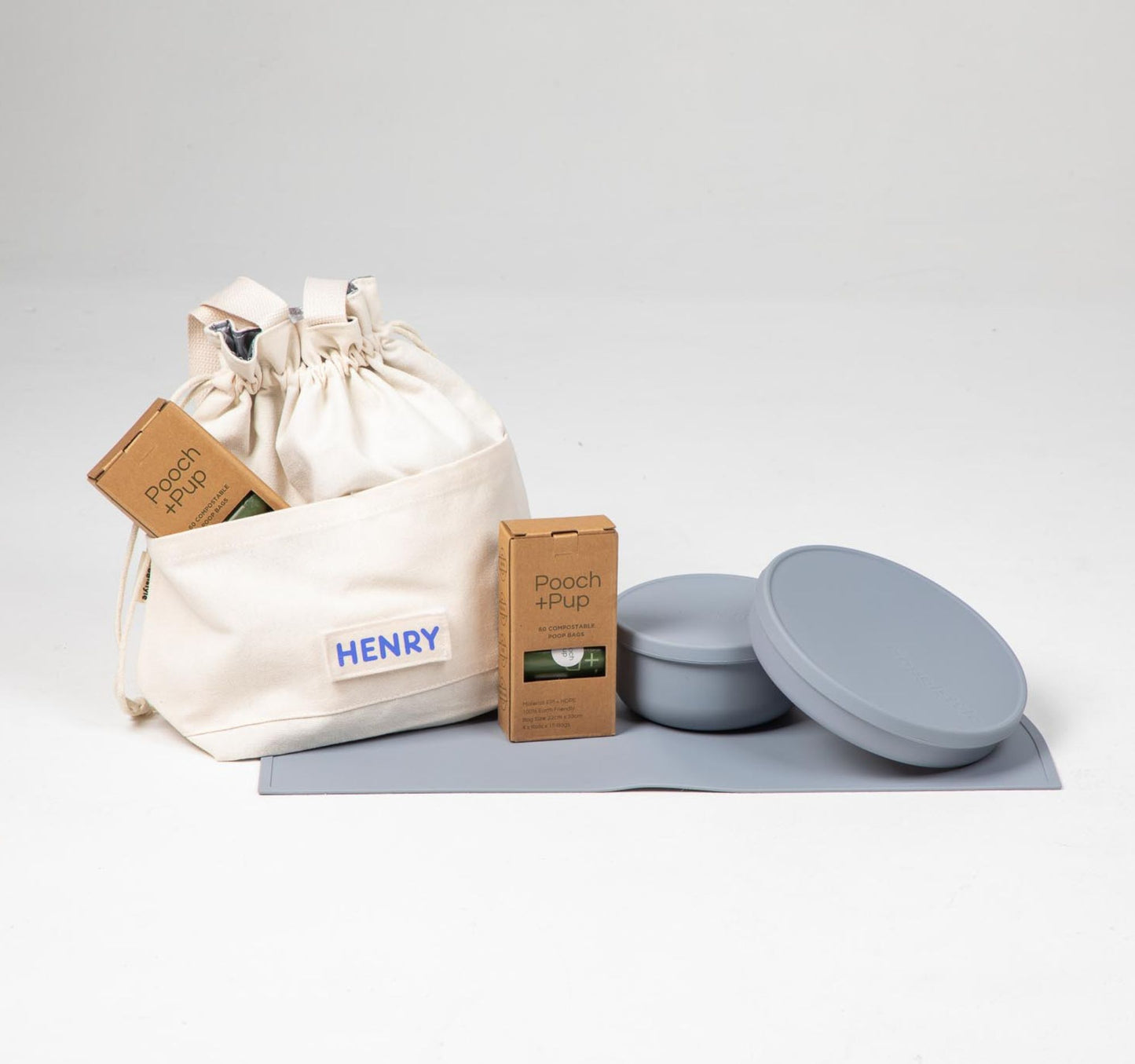 Dog food cooler travel bag & dog bowls with lid in blue plus compostable poop bags.