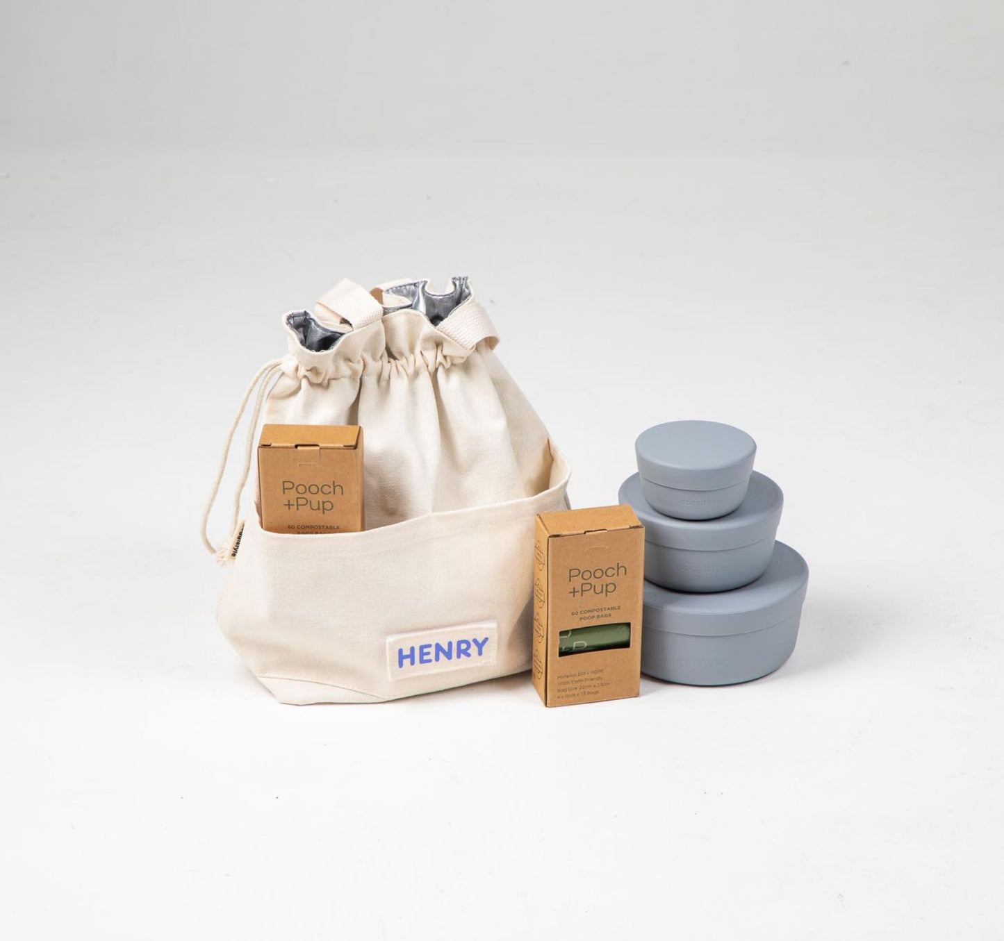 Travel Cooler Tote with blue silicone dog food storage containers and poop bags, leak-proof and portable for dog meals on the go.
