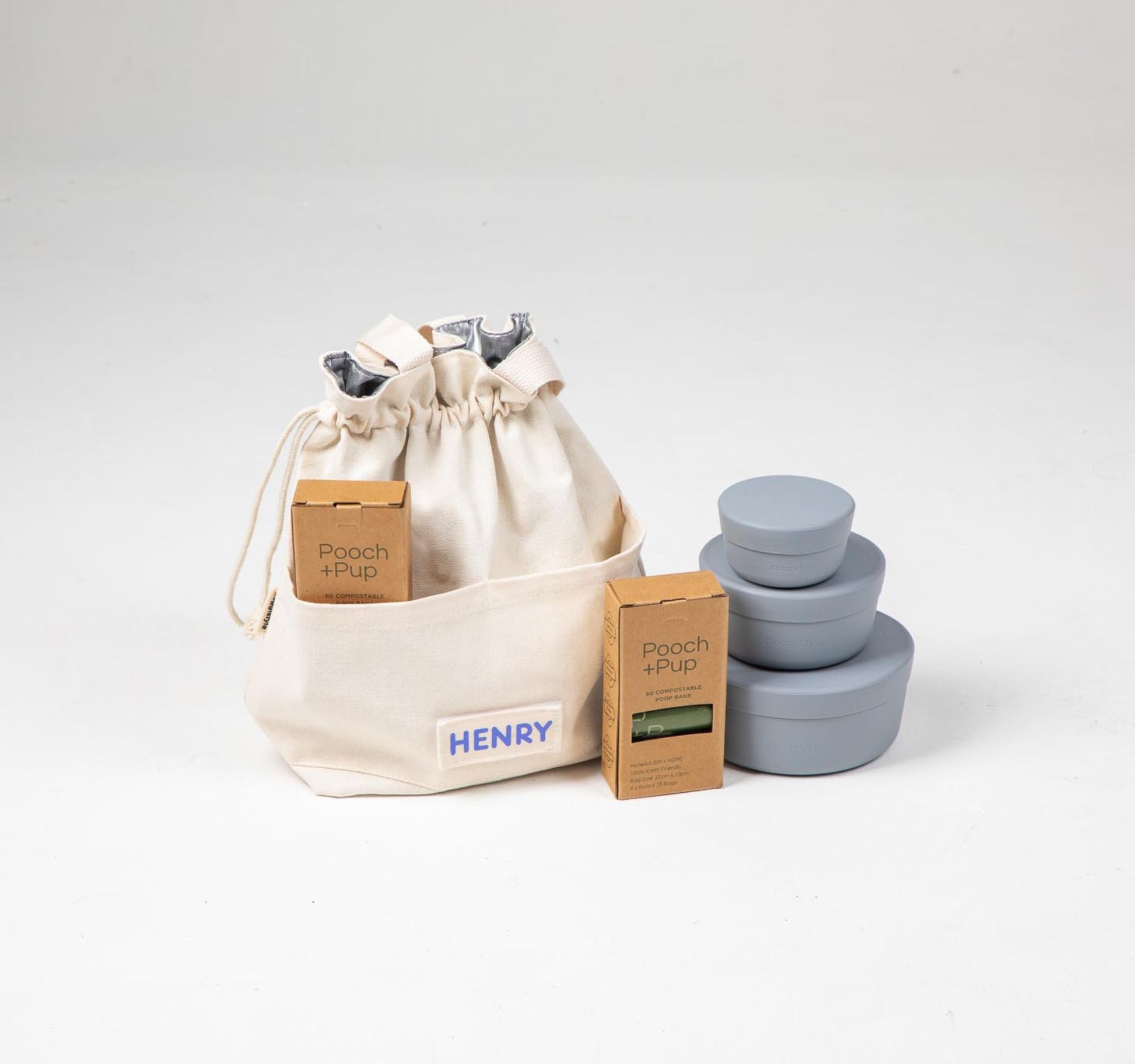 Travel Cooler Tote with blue silicone dog food storage containers and poop bags, leak-proof and portable for dog meals on the go.
