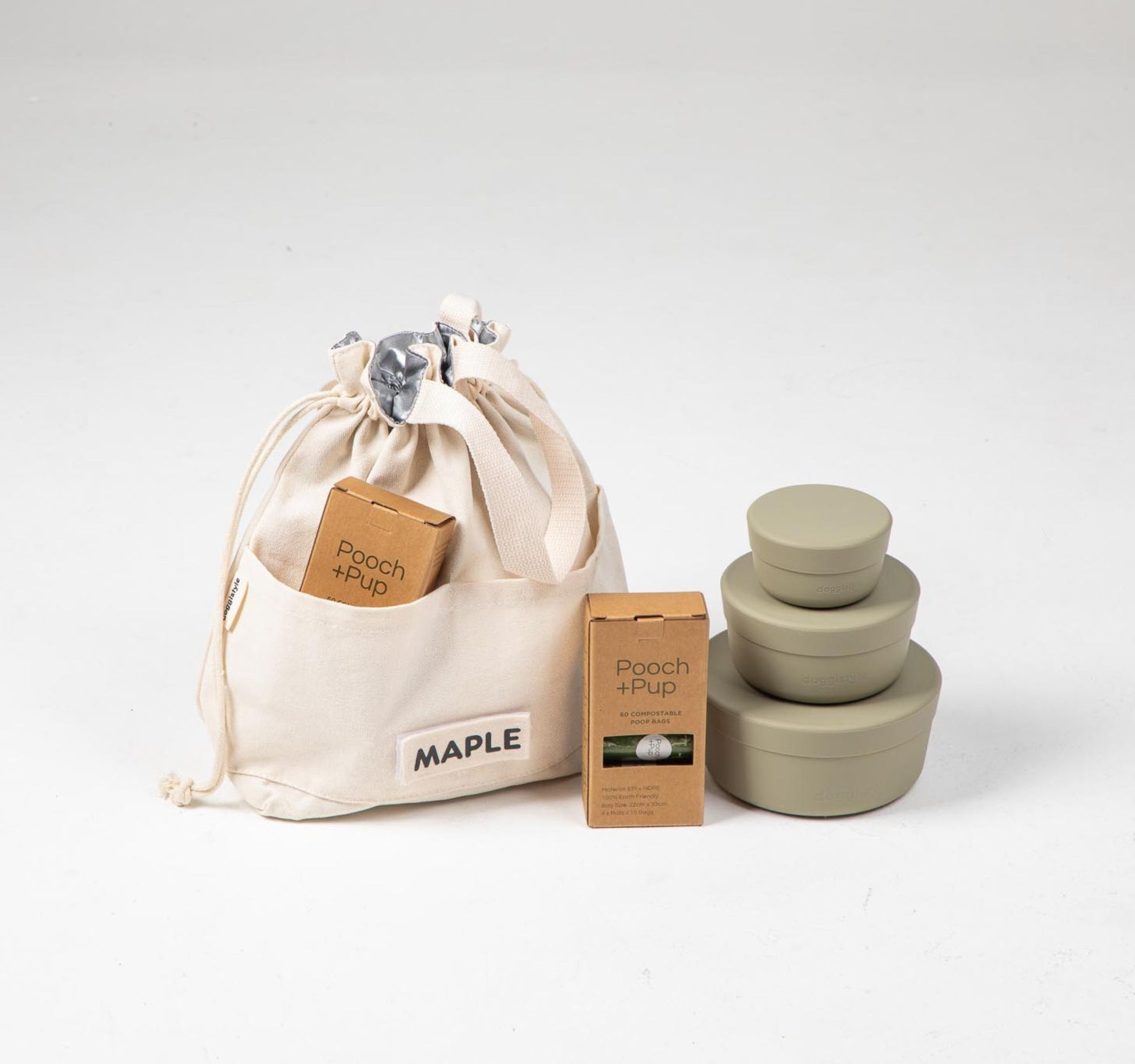 Dog food cooler travel bag & dog food storage containers in green plus compostable poop bags.