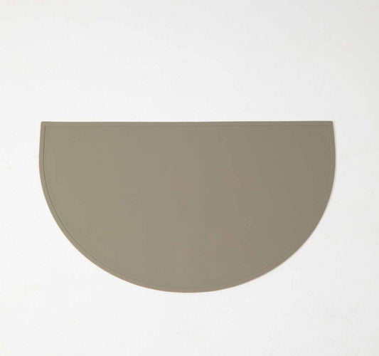 Dog Food & water mat made with 100% food-grade silicone with a non-slip base, raised edges to contain mess in green.